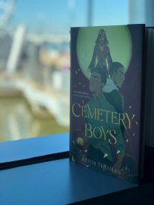 Cemetery Boys book sitting in a window sill 