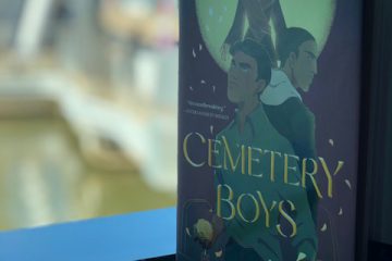 Cemetery Boys book sitting on a window sill