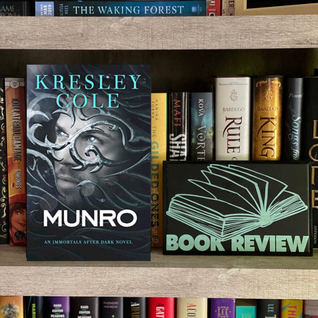 A book cover rests on a bookshelf reflecting a man with blue eyes looks out through curved, ornate metal bars